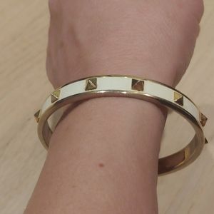 Coach Bangle white with gold spikes